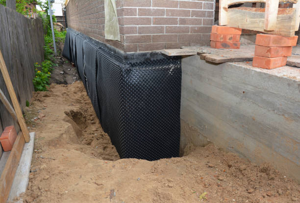 SJ Waterproofing Pros technician performing targeted Interior Drainage System assessment in Paris, KY